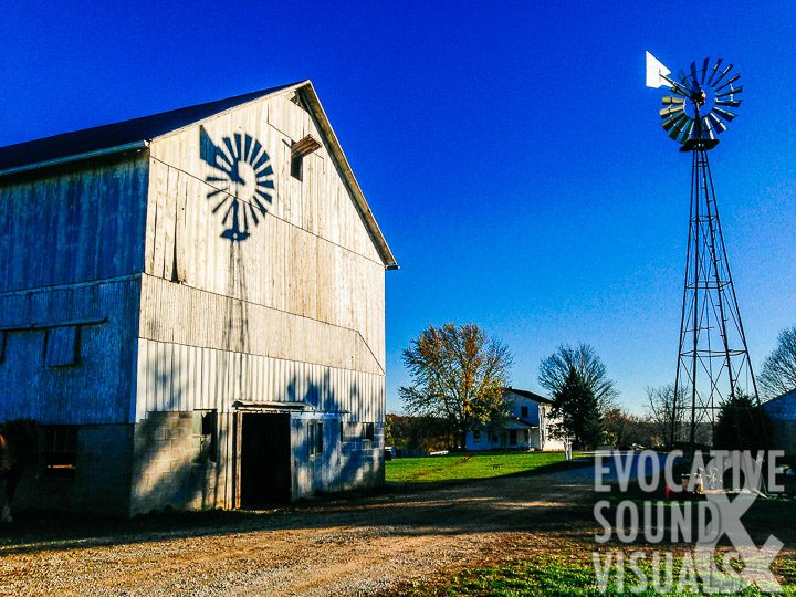 A windmill's shadow falls upon the weathered wood of Ivan Miller's barn near Greenwich, Ohio, Thursday, November 10, 2016. Photo by Richard Alan Hannon