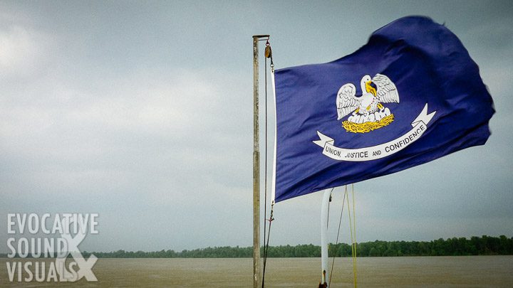 The Louisiana state flag flies at the bow of a ferryboat crossing the Mississippi River on June 29, 2009. Photo by Richard Alan Hannon