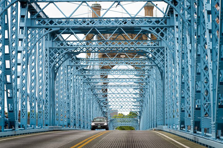 The John A. Roebling Suspension Bridge, with its corrugated steel decking, spans the Ohio River between Cincinnati, Ohio and Covington, Kentucky. Photo by Adam Lau.