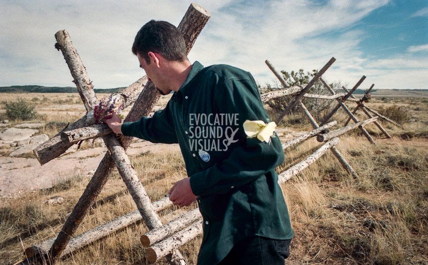 Graham Baxendale, a visiting lecturer at the University of Wyoming on hate crimes from Reading, England, finds an opportunity during lunch to pause where Matthew Shepard was tied to a buck-and-rail fence a mile northeast of Laramie. Photo by Richard Alan Hannon
