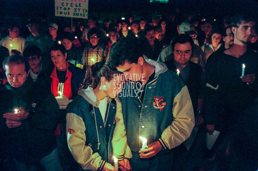A couple participates in a 1000-person vigil at St. Paul's Newman Center across from the University of Wyoming in Laramie, Wyoming, Sunday, October 11, 1998 to support openly gay UW student Matthew Shepard. Shepard was beaten, burned, tied to a fence, and left for dead in the early morning hours of Wednesday, October 7, 1998. Hours after the vigil, Shepard, 21, died at Poudre Valley Hospital in Fort Collins, Colorado. Photo by Richard Alan Hannon
