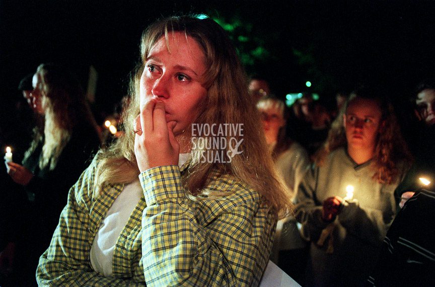 A woman participates in a 1000-person vigil at St. Paul's Newman Center across from the University of Wyoming in Laramie, Wyoming, Sunday, October 11, 1998 to support openly gay UW student Matthew Shepard. Shepard was beaten, burned, tied to a fence, and left for dead in the early morning hours of Wednesday, October 7, 1998. Hours after the vigil, Shepard, 21, died at Poudre Valley Hospital in Fort Collins, Colorado. Photo by Richard Alan Hannon