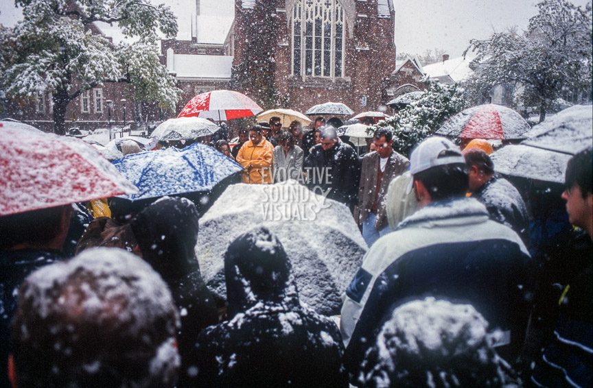 Matthew Shepard's friends and mourners brave heavy snow and snapping tree limbs to gather outside St. Mark's Episcopal Church in Casper, Wyoming on Friday, October 16, 1998 to listen to a radio broadcast of the funeral services inside. Shepard had been baptized at the church. Photo by Richard Alan Hannon