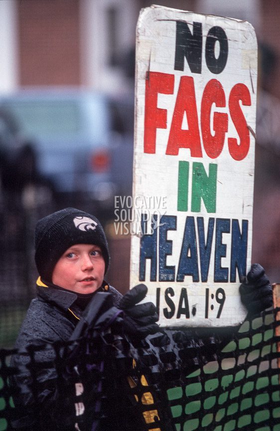 A young member of the Westboro Baptist Church of Topeka, Kansas, is confined to a corral outside St. Mark's Episcopal Church in Casper, Wyo. on Friday, October 16, 1998 prior to Matthew Shepard's funeral. Photo by Richard Alan Hannon