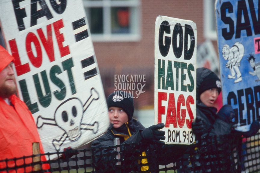 A young member of the Westboro Baptist Church of Topeka, Kansas, is of approximately 15 protesters confined to a corral outside St. Mark's Episcopal Church in Casper, Wyo. on Friday, October 16, 1998 prior to Matthew Shepard's funeral. Photo by Richard Alan Hannon