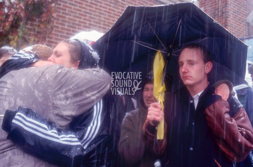 Matthew Shepard's friends and mourners brave heavy snow and snapping tree limbs to gather outside St. Mark's Episcopal Church in Casper, Wyoming Friday, October 16, 1998 to listen to a radio broadcast of the funeral services inside. Shepard had been baptized at the church. Photo by Richard Alan Hannon