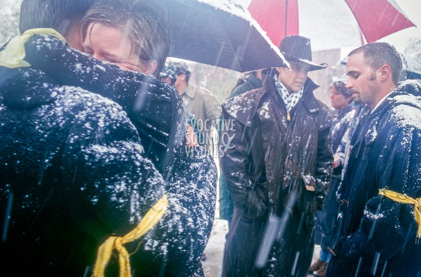 Matthew Shepard's friends and mourners brave heavy snow and snapping tree limbs to gather outside St. Mark's Episcopal Church in Casper, Wyoming on Friday, October 16, 1998 to listen to a radio broadcast of the funeral services inside. Shepard had been baptized at the church. Photo by Richard Alan Hannon