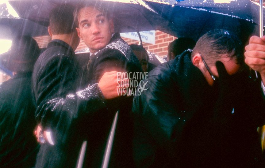 Matthew Shepard's friends and mourners brave heavy snow and snapping tree limbs to gather outside St. Mark's Episcopal Church in Casper, Wyoming on Friday, October 16, 1998 to listen to a radio broadcast of the funeral services inside. Shepard had been baptized at the church. Photo by Richard Alan Hannon