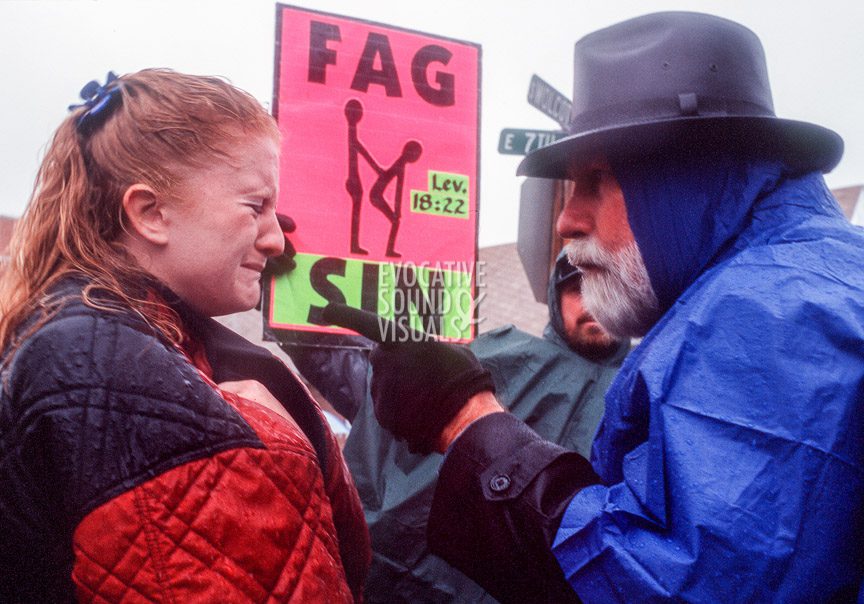 Rachel Anderson of Casper, Wyoming cries after Pastor W.T. Otwell of God Said Ministries of Mt. Enterprise, Texas answers her question of why he came out to preach his anti-gay message on the day of Matthew Shepard’s funeral. ‘He is dead, this is not their place,’ said Anderson of the protester's presence. Photo by Richard Alan Hannon