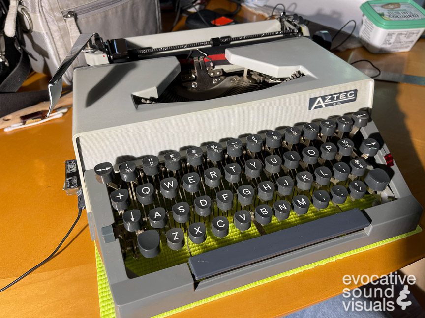 Recording the sound of an Aztec 14 typewriter, made in Soviet-occupied Germany in 1963, with a pair of contact microphones. Photo by Richard Alan Hannon