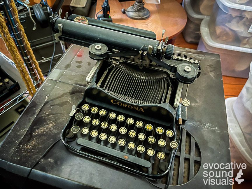 Recording the sound of a vintage Corona Number 3 folding typewriter inside the Bedford Historical Society in Bedford, Ohio on Tuesday, May 30, 2023. Photo by Richard Alan Hannon