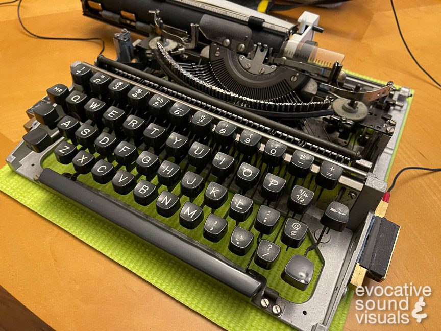 Recording the sound of an Olympia Traveller ultraportable typewriter with a pair of contact microphones. Photo by Richard Alan Hannon