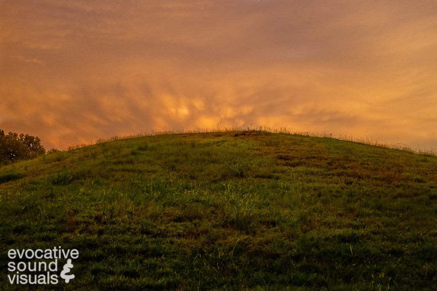 The sun sets behind a Mound B at Poverty Point State Historic Site in north Louisiana. Photo © Richard Alan Hannon