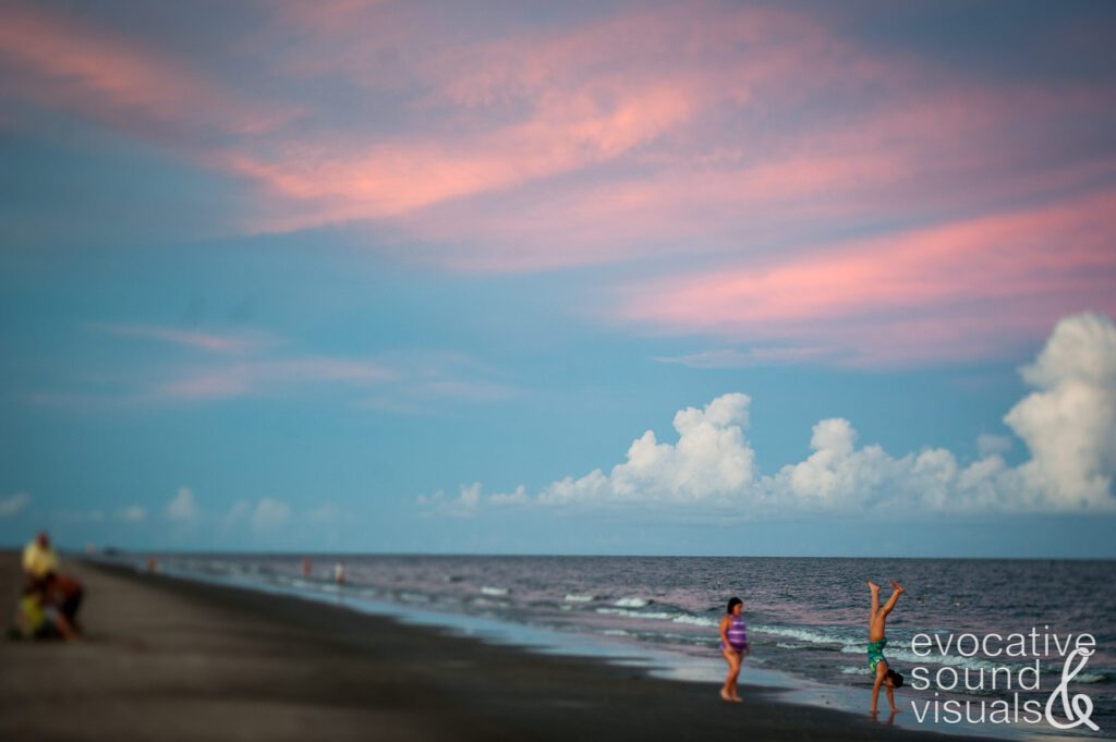 Children do cartwheels on Grand Isle beach in Grand Isle, La. August 15, 2009. Photo by Richard Alan Hannon