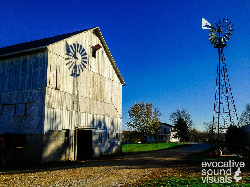 A windmill's shadow falls upon the weathered wood of an Amish barn near Shenandoah, Ohio, Thursday, November 10, 2016. Photo by Richard Alan Hannon