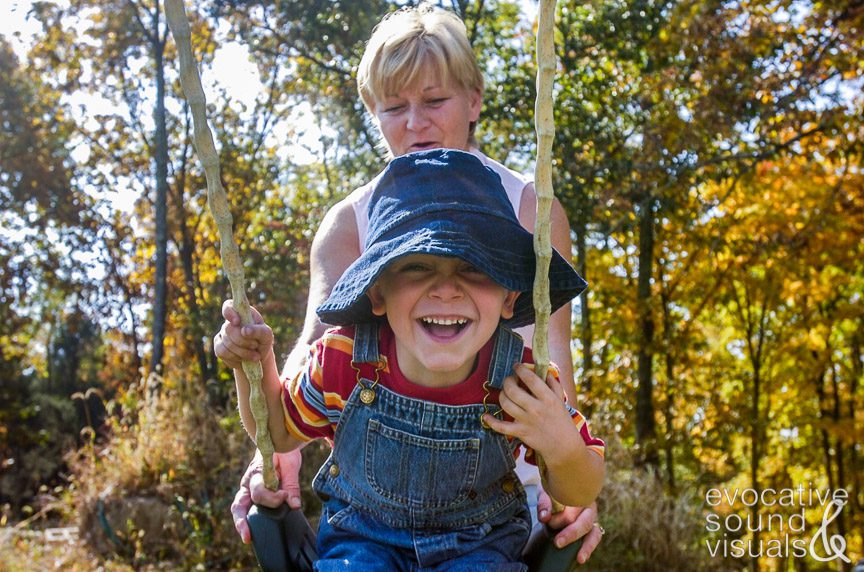 Melinda Earlywine plays with her grandson Jacob on a swing on a fall day in Lawrenceburg, Kentucky.
