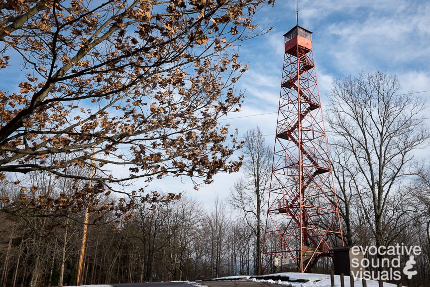 Recording the sound of wind hitting the 80-foot (24-meter) firetower at Mohican State Park on February 19, 2016. Photo by Richard Alan Hannon