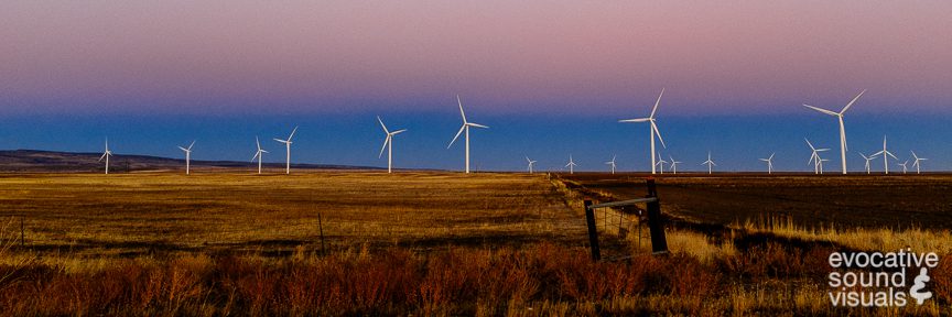 Multiple 123.10 meter tall S88 wind turbines, manufactured by Suzlon Energy and installed in 2009, are seen at twilight in Glenns Ferry, Idaho on October 12, 2018. Part of the Mountain Home Wind Project, each turbine, with a rotor diameter of 88 metes, can produce 2.5 MW of electricity. Photo by Richard Alan Hannon