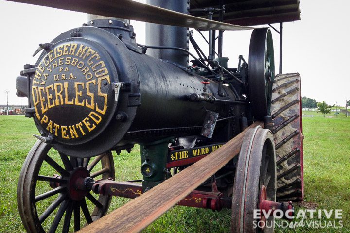 The Geiser "Peerless Model Q", a 10-horsepower steam traction engine made in 1897 by the Geiser Manufacturing Company of Waynesboro, Pennsylvania and owned and engineered by Paul Ward of Lexington, Ohio, at the 19th annual Buckeye Iron Will Club Tractor & Gas Engine Show at the Richland County Fairgrounds in Mansfield, Ohio, September 10, 2016. Ward was using the engine to cut walnut slab wood donated to him from an Amish sawmill in Johnsville, Ohio. The engine converts stored energy from wood to heat two 90-gallon water tanks in the rear of the engine, plus a 210-gallon boiler up front, to make steam, which in turn powers a belt that runs a buzz saw. Two petcocks located on the right side of the engine release steam and sound as their drain the cylinder of water that has condensed. The engine’s brass whistle is made by Buckeye.

Photo by Richard Alan Hannon